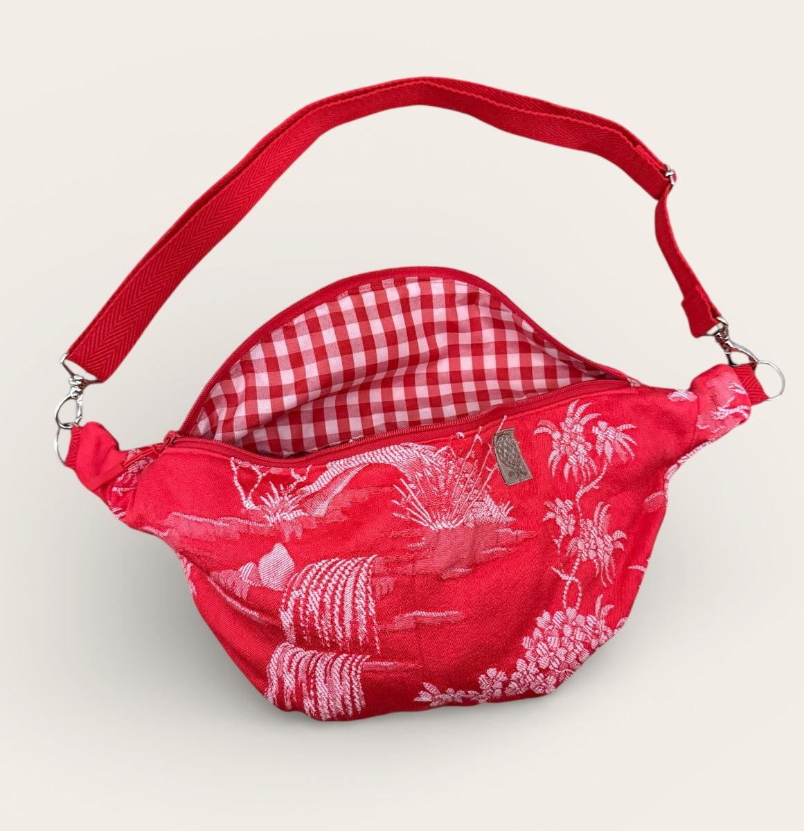 Riñonera roja grulla